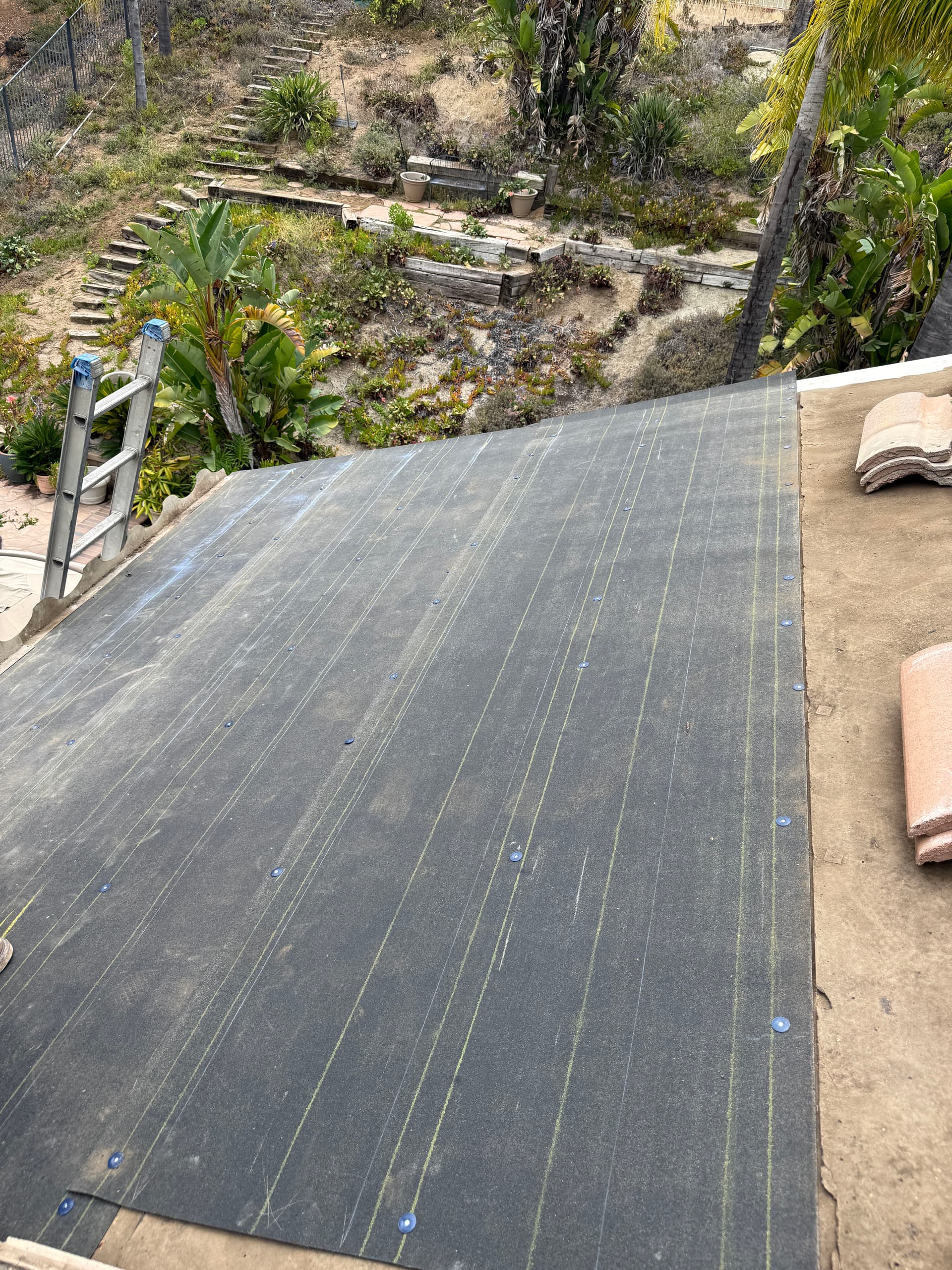 Gallery photos for What Water-Damaged Wood Under a Tile Roof Actually Looks Like: Image #3